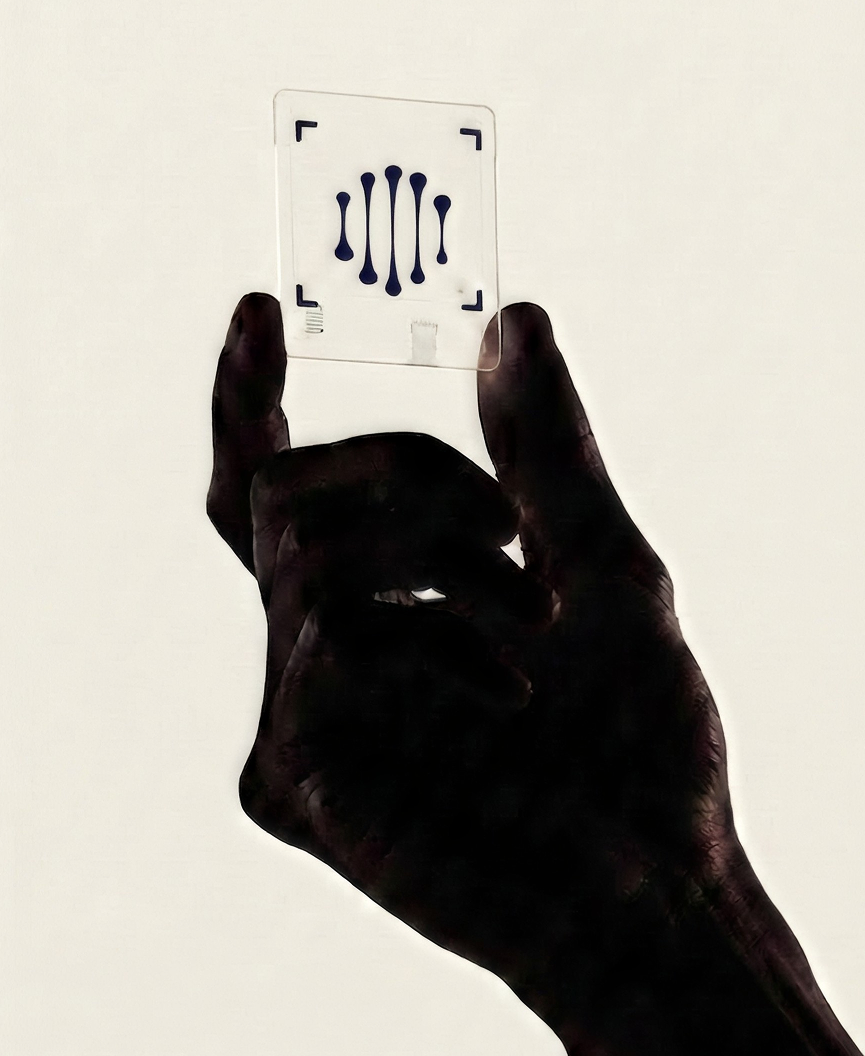 A hand holds a laboratory slide up to the light, with the SciScreen mark etched on it.